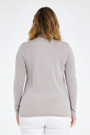 Model Jess wearing size 14 of the Merino Wool Skivvy in colour Natural, from the back