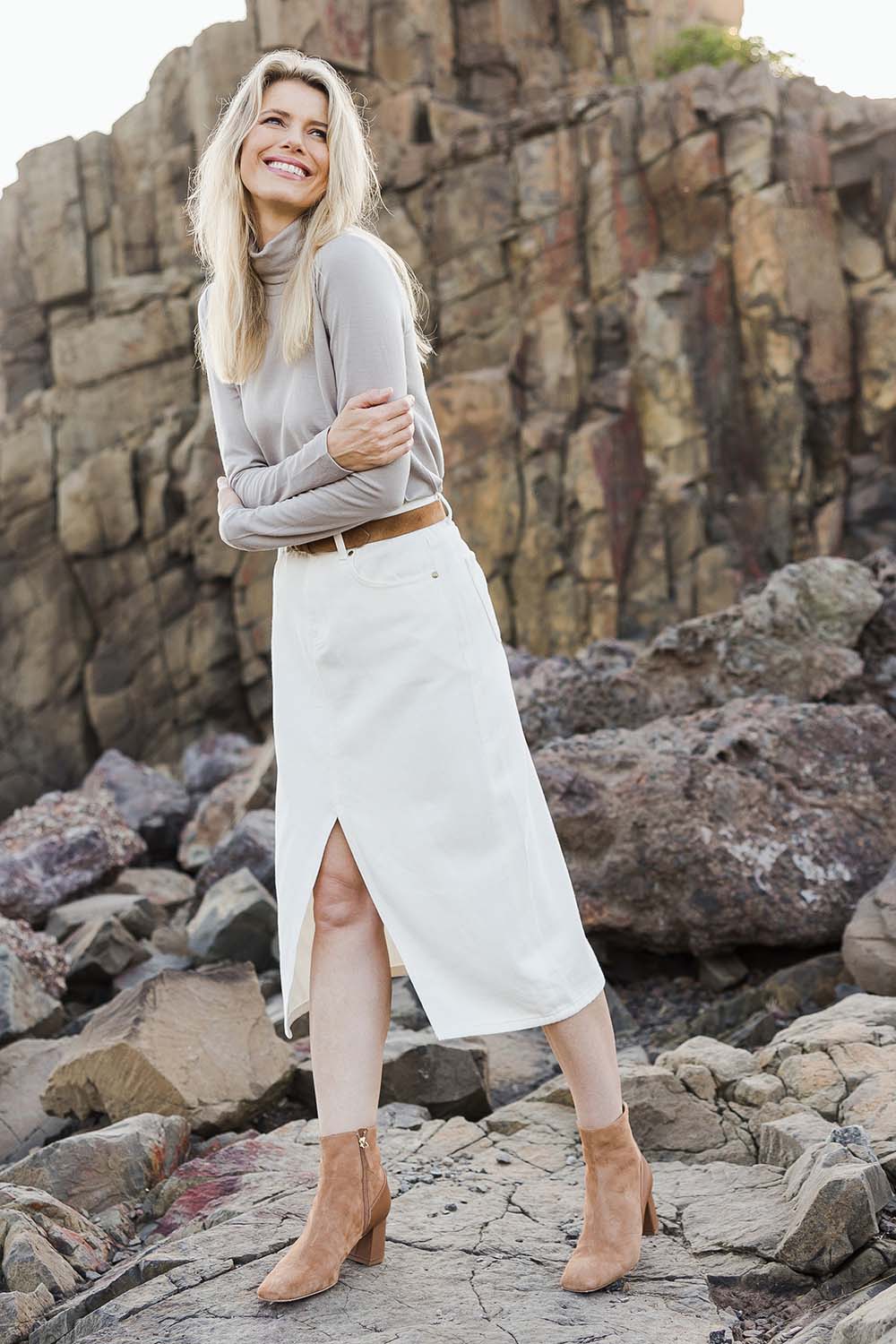 Model Kelly wearing size 10 of the Merino Wool Skivvy in colour Natural, from the front, showing the whole outfit