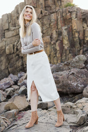 Model Kelly wearing size 10 of the Merino Wool Skivvy in colour Natural, from the front, showing the whole outfit
