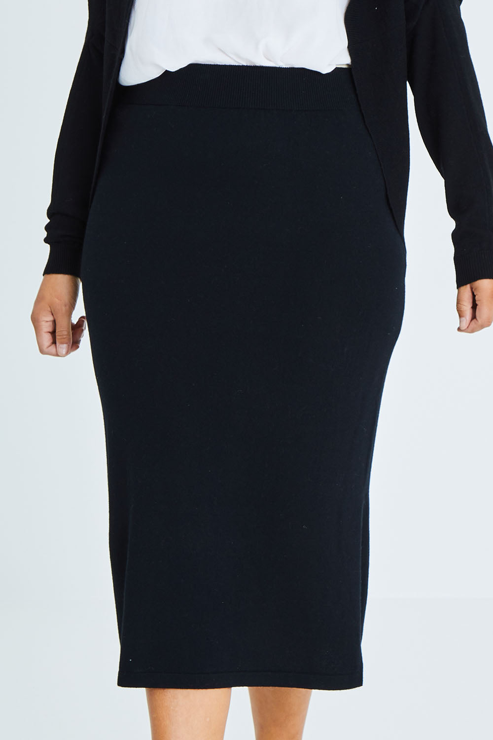 Model Palatina wearing size XL of the Merino Wool Cocoon Cardigan in colour Black (Black), from the front, cropped image