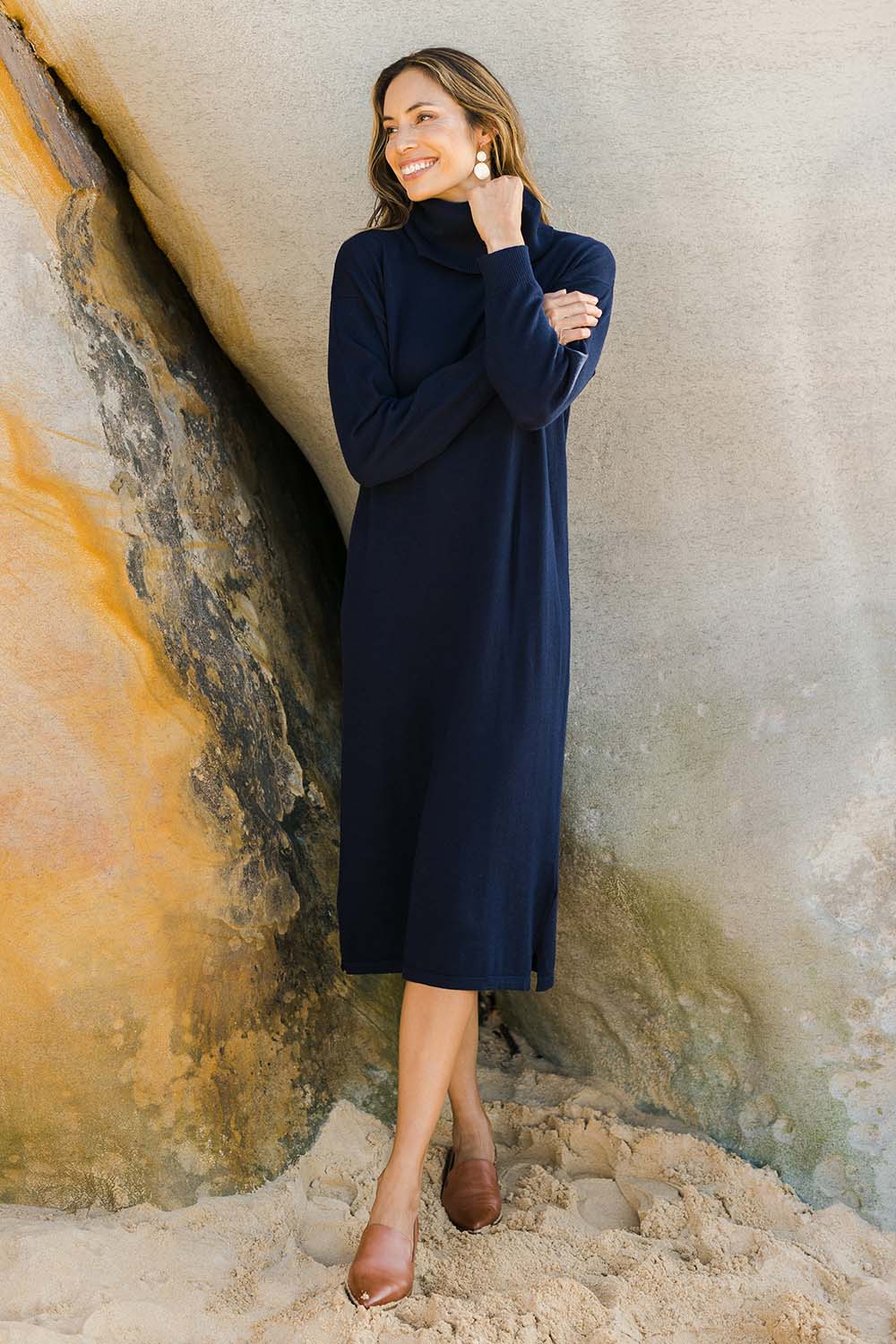 Model Amanda wearing size S of the Cotton Cashmere Rolled Neck Knit Dress in colour Navy (Blue), from the front, showing the whole outfit