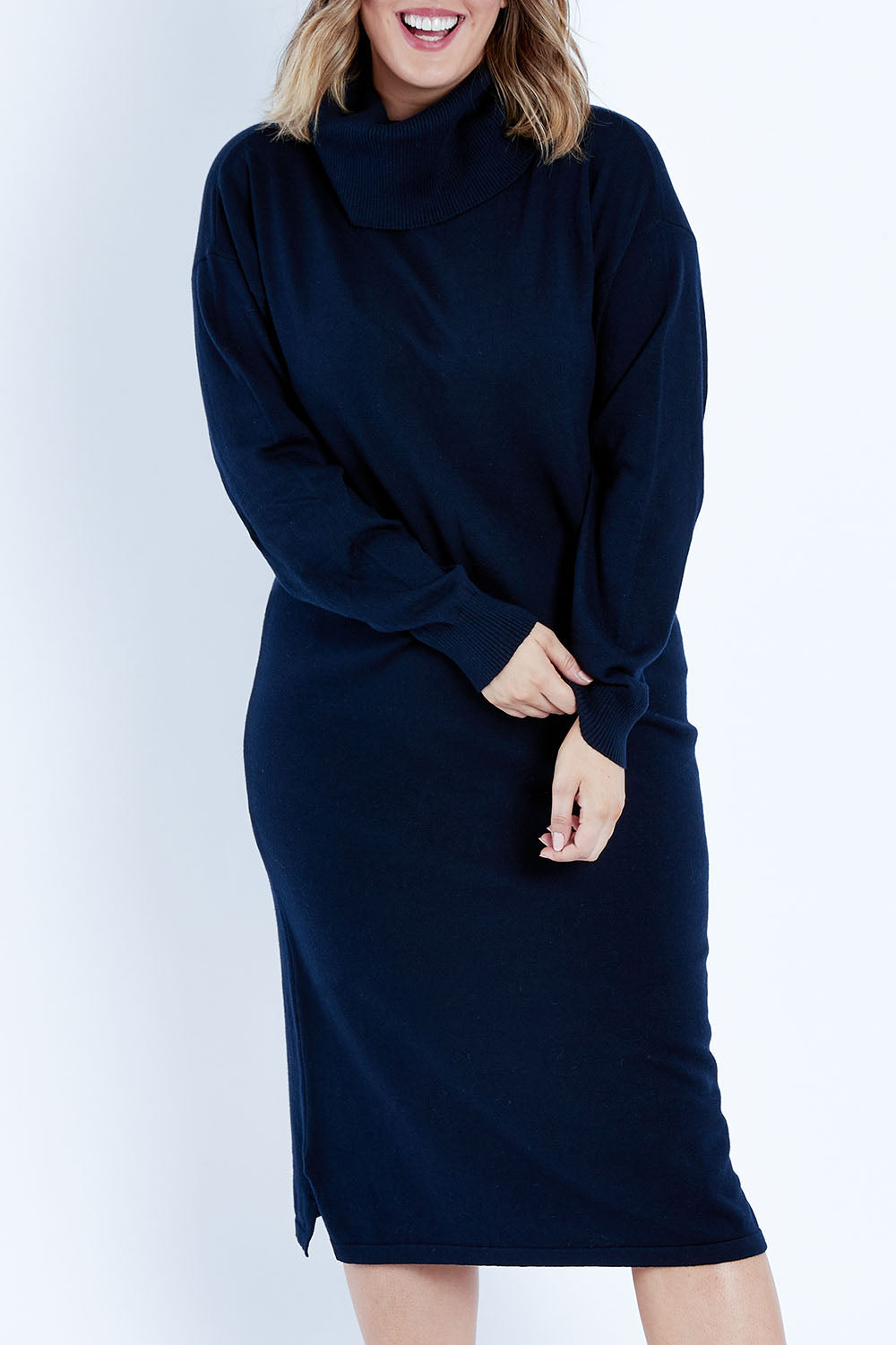 Model Jess wearing size L of the Cotton Cashmere Rolled Neck Knit Dress in colour Navy (Blue), from the front, cropped image