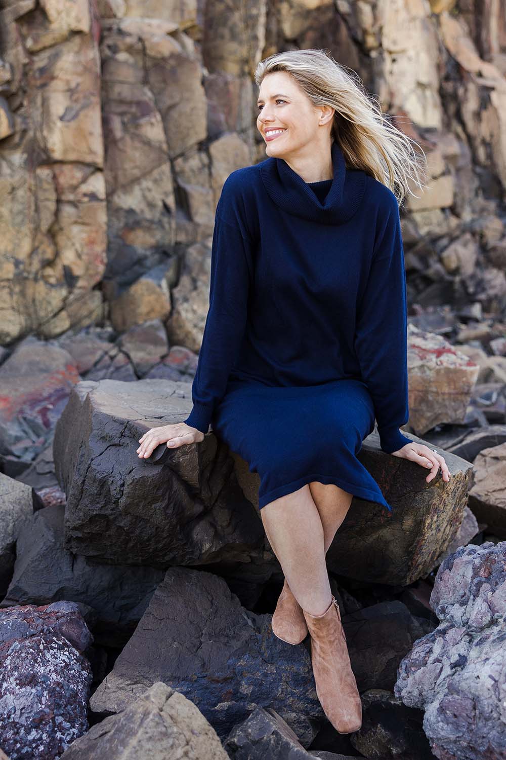 Model Kelly wearing size S of the Cotton Cashmere Rolled Neck Knit Dress in colour Navy (Blue), from the front, showing the whole outfit