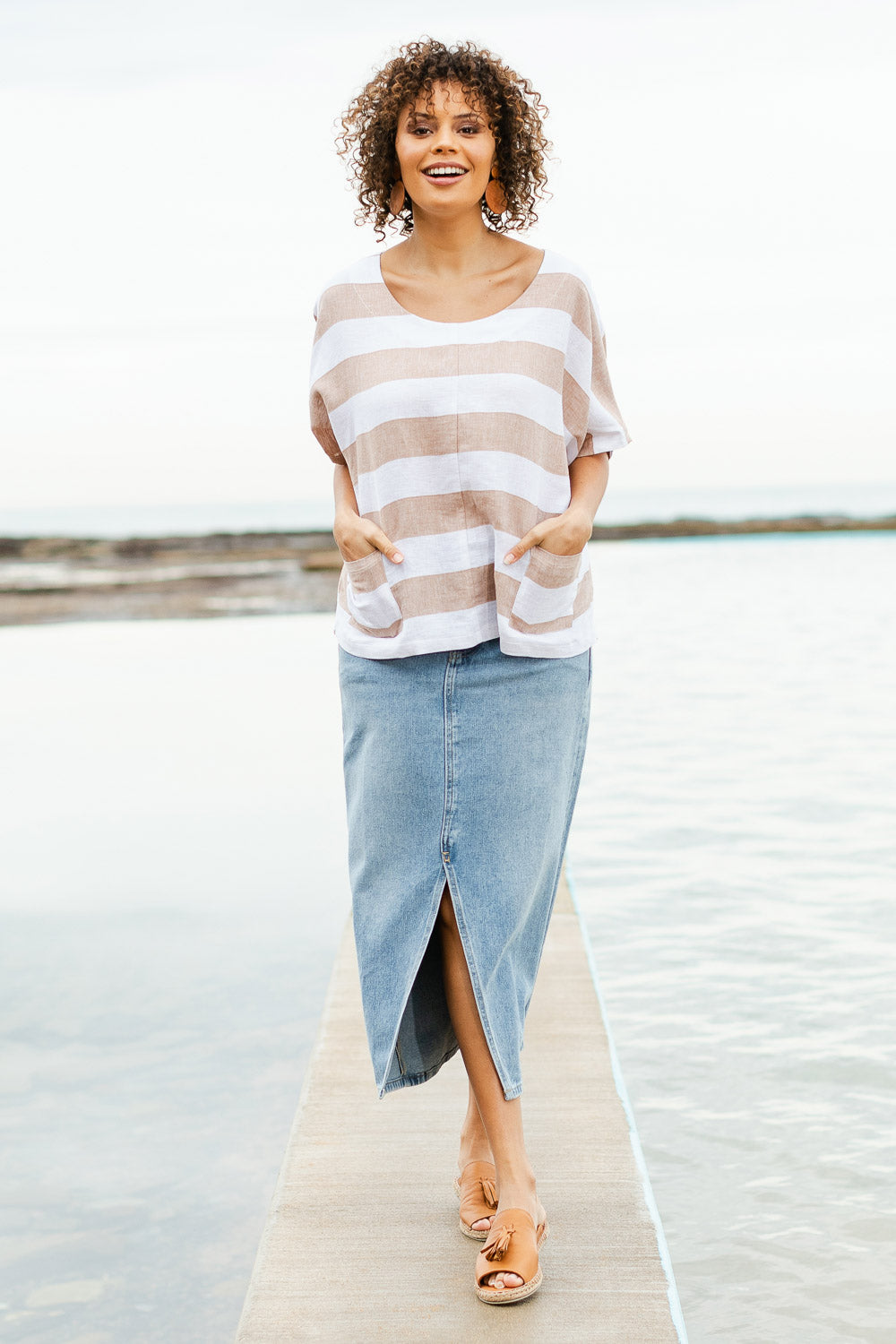 Model Lala wearing size 10 of the Linen Stripe Pocket Blouse in colour Caramel, from the front, showing the whole outfit