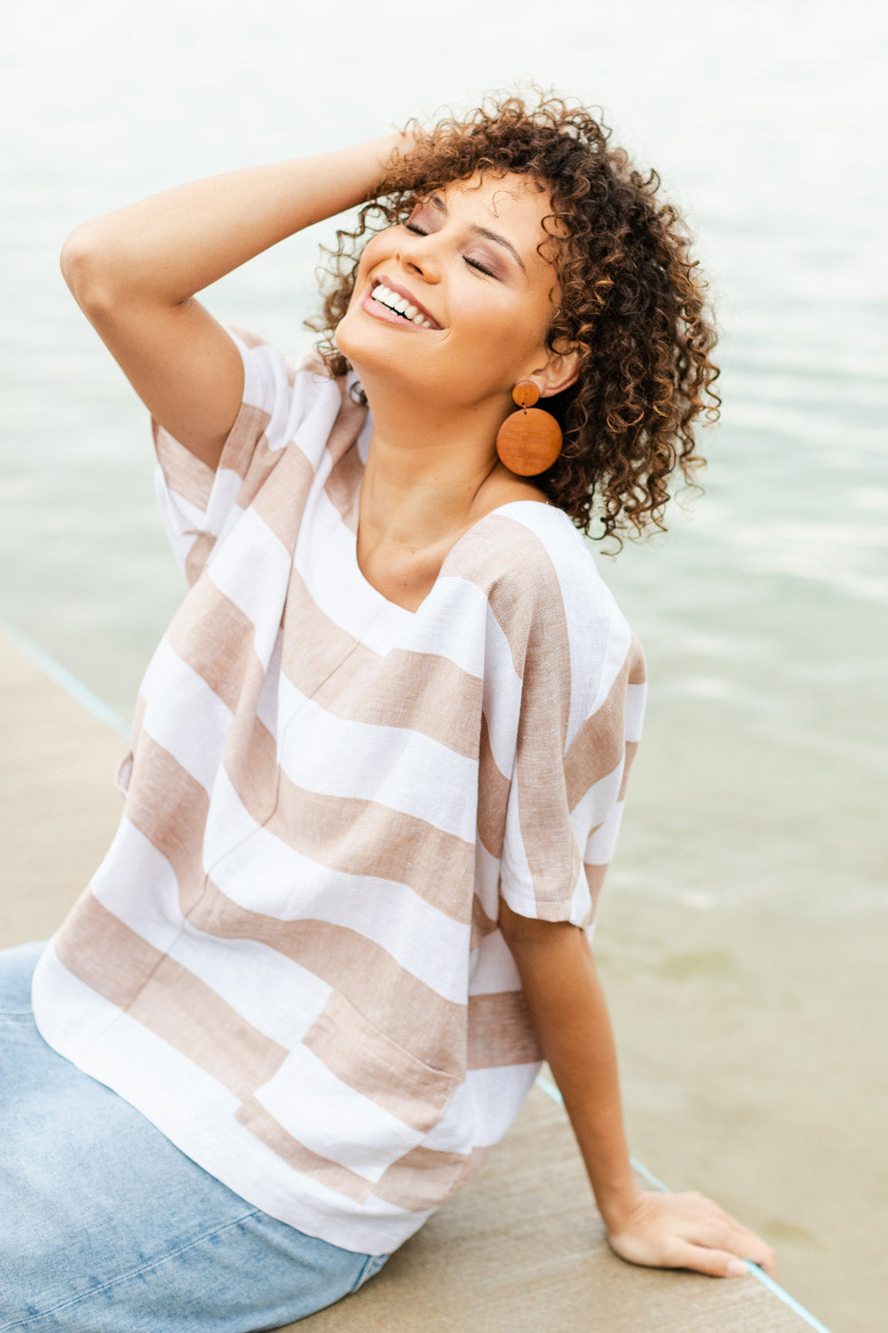 Model Lala wearing size 10 of the Linen Stripe Pocket Blouse in colour Caramel, from the front, showing the whole outfit
