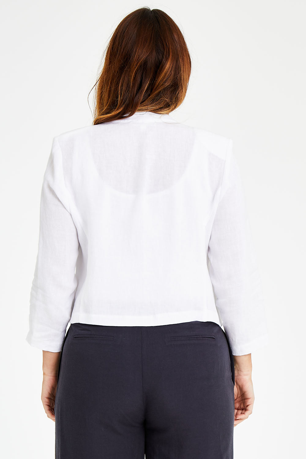 Model Laura wearing size 14 of the Essential Linen Blazer in colour White (White), from the back