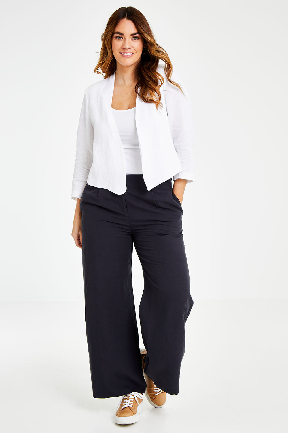 Model Laura wearing size 14 of the Essential Linen Blazer in colour White (White), from the front, showing the whole outfit