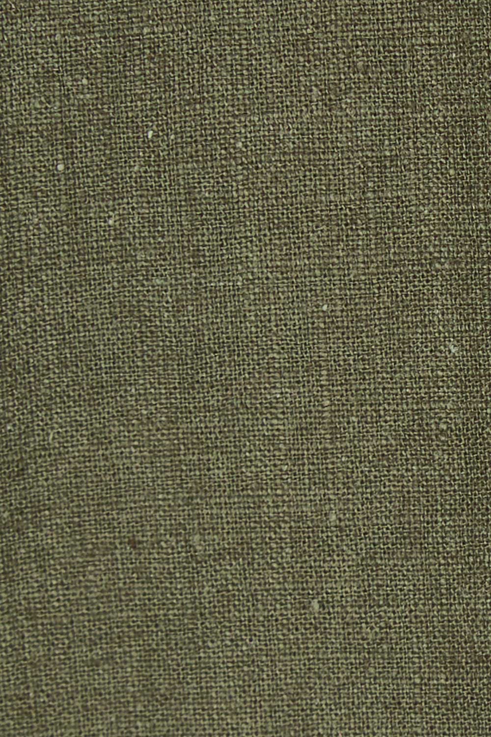 Product shot of the Ramie Empire Line Dress in colour Green (Green), detail