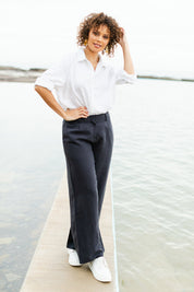 Model Lala wearing size 10 of the Linen Blend Wide Leg Pant in colour Inknavy (Blue), from the front, showing the whole outfit