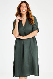Model Laura wearing size 14 of the Linen Summer Relaxed Dress in colour Green (Green), from the front, cropped image