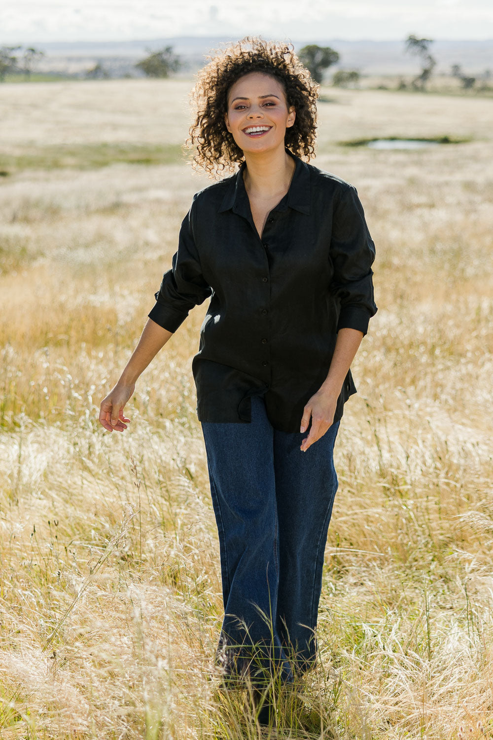 Model Lala wearing size 10 of the Linen Oversized Boyfriend Shirt in colour Black (Black), from the front, showing the whole outfit