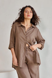 Model Tahneei wearing size 10 of the Linen Oversized Boyfriend Shirt – Coffee in colour Coffee, in a cropped view