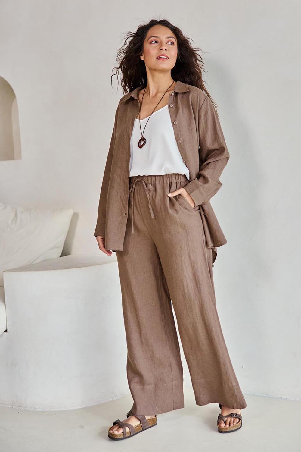 Model Tahneei wearing size 10 of the Linen Oversized Boyfriend Shirt – Coffee in colour Coffee, from the front