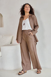 Model Tahneei wearing size 10 of the Linen Oversized Boyfriend Shirt – Coffee in colour Coffee, from the front