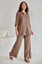 Model Tahneei wearing size 10 of the Linen Oversized Boyfriend Shirt – Coffee in colour Coffee, from the front