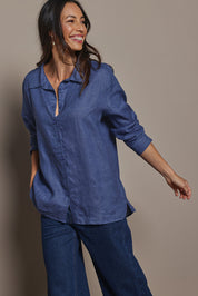 Model Amandam wearing size 10 of the Linen Oversized Boyfriend Shirt - Denim in colour Denim, from an angle