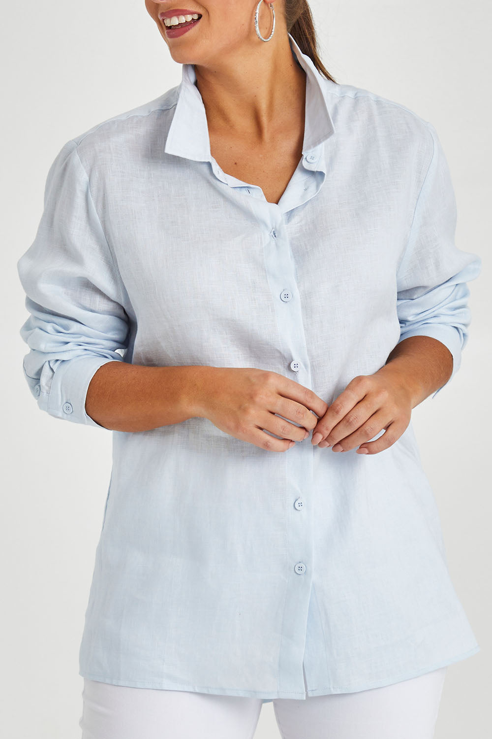 Model Monique wearing size 14 of the Linen Oversized Boyfriend Shirt in colour Lightblue (Blue), from the front, cropped image