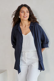 Model Tahneei wearing size 10 of the Linen Oversized Boyfriend Shirt - Navy in colour Navy, in a cropped view