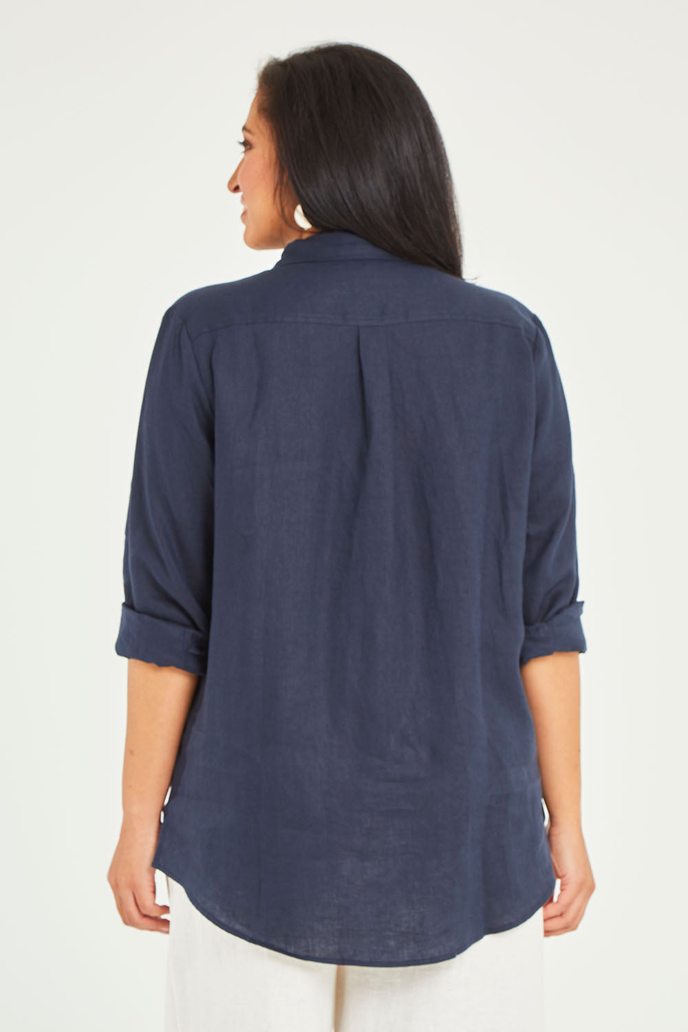 Model Terri-Leigh wearing size 14 of the Linen Oversized Boyfriend Shirt in colour Navy (Blue), from the back