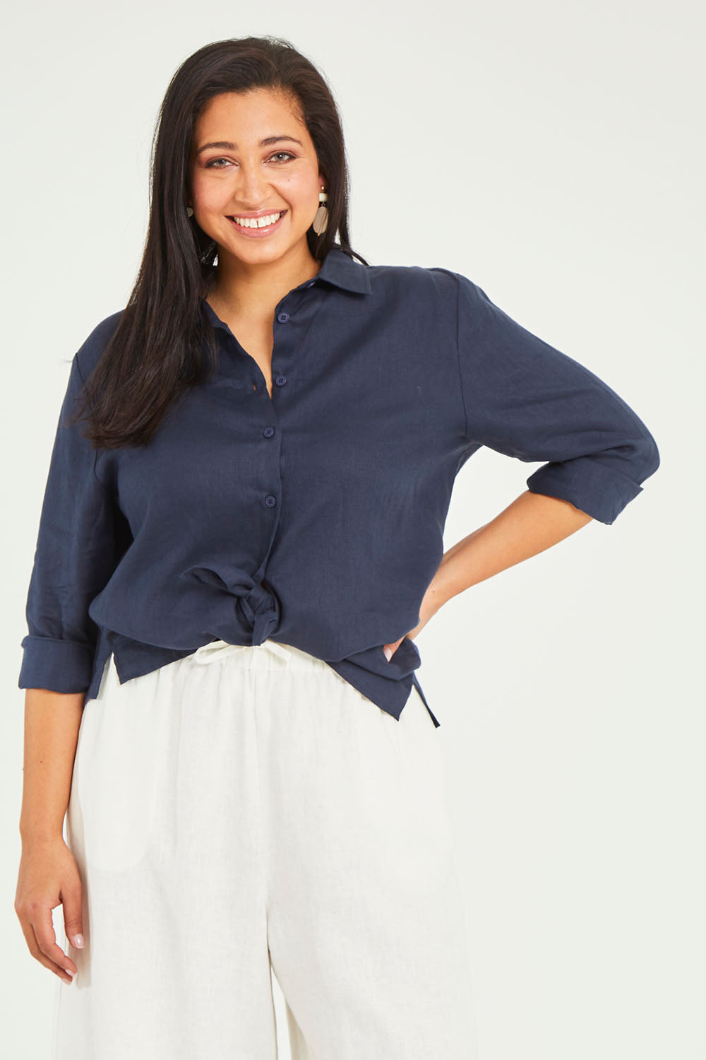 Model Terri-Leigh wearing size 14 of the Linen Oversized Boyfriend Shirt in colour Navy (Blue), from the front, cropped image
