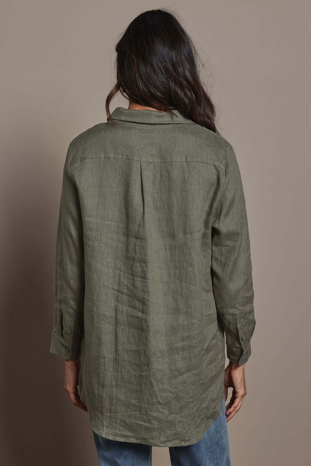 Model Amanda wearing size 10 of the Linen Oversized Boyfriend Shirt in colour Olive (Green), from the back