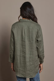 Model Amanda wearing size 10 of the Linen Oversized Boyfriend Shirt in colour Olive (Green), from the back