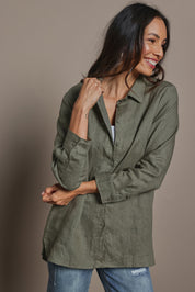 Model Amanda wearing size 10 of the Linen Oversized Boyfriend Shirt in colour Olive (Green), from the front, cropped image
