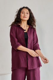 Model Tahneei wearing size 10 of the Linen Oversized Boyfriend Shirt – Plum in colour Plum, from an angle