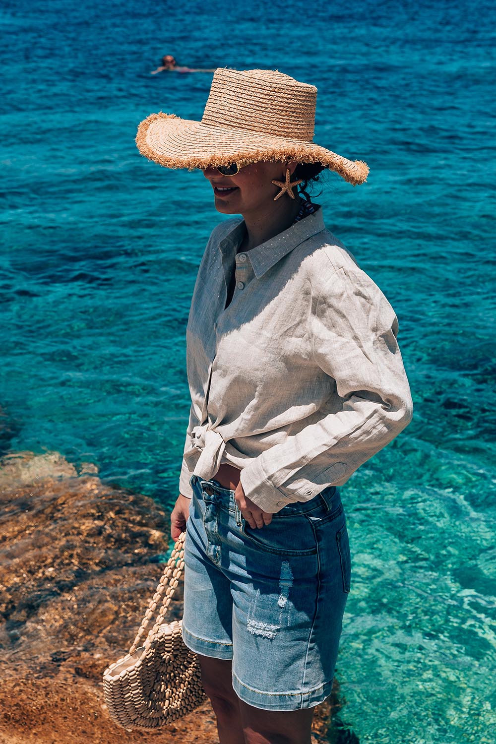 A model wearing the Linen Oversized Boyfriend Shirt in colour Sand, from the front, showing the whole outfit