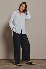 Model Amanda wearing size 10 of the Linen Oversized Boyfriend Shirt in colour White (White), from the front, showing the whole outfit