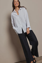 Model Amanda wearing size 10 of the Linen Oversized Boyfriend Shirt in colour White (White), from the front, showing the whole outfit