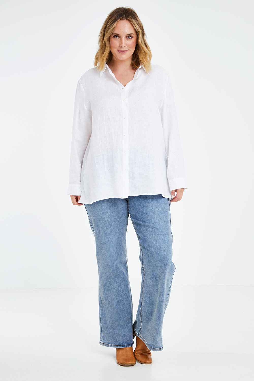 Model Jess wearing size 14 of the Linen Oversized Boyfriend Shirt in colour White (White), from the front, showing the whole outfit