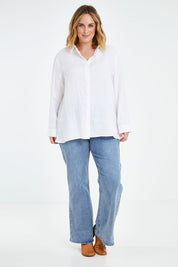 Model Jess wearing size 14 of the Linen Oversized Boyfriend Shirt in colour White (White), from the front, showing the whole outfit