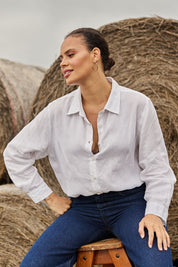 Model Lala wearing size 10 of the Linen Oversized Boyfriend Shirt in colour White (White), from the front, showing the whole outfit