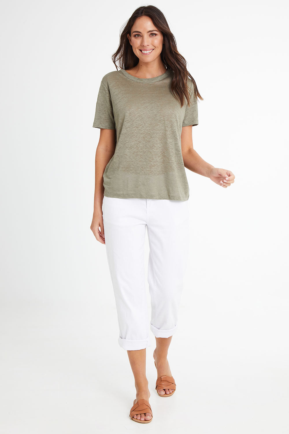 Model Madeline wearing size 10 of the Linen Scoop Neck Top in colour Green (Green), from the front, showing the whole outfit