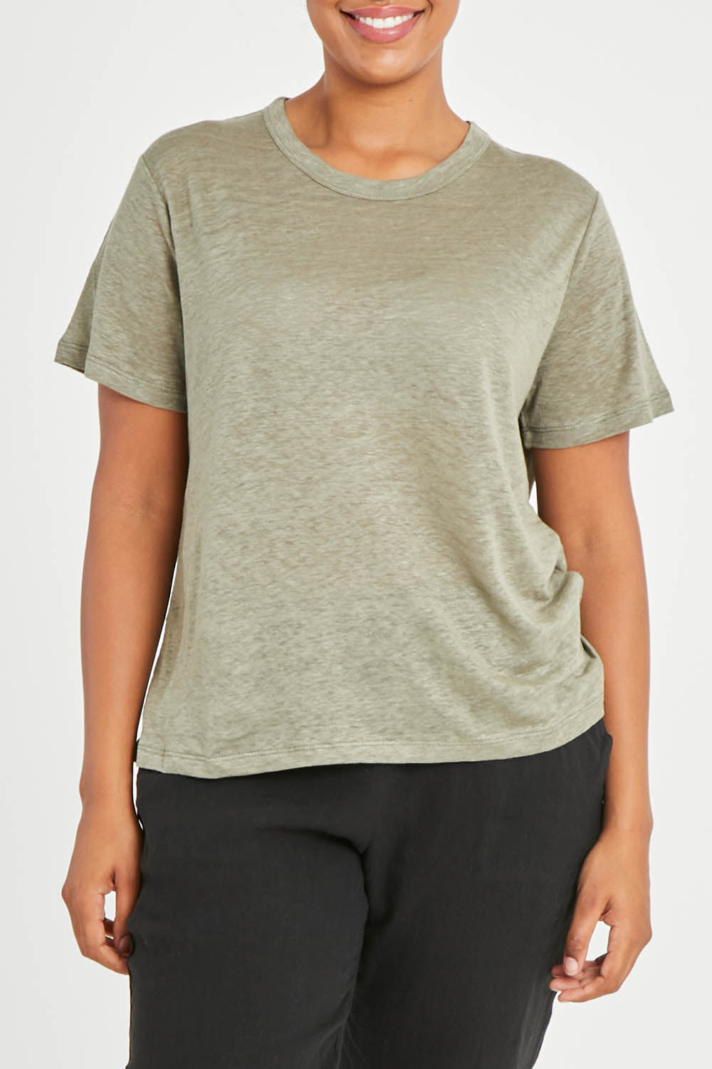 Model Noli wearing size 14 of the Linen Scoop Neck Top in colour Green (Green), from the front, cropped image