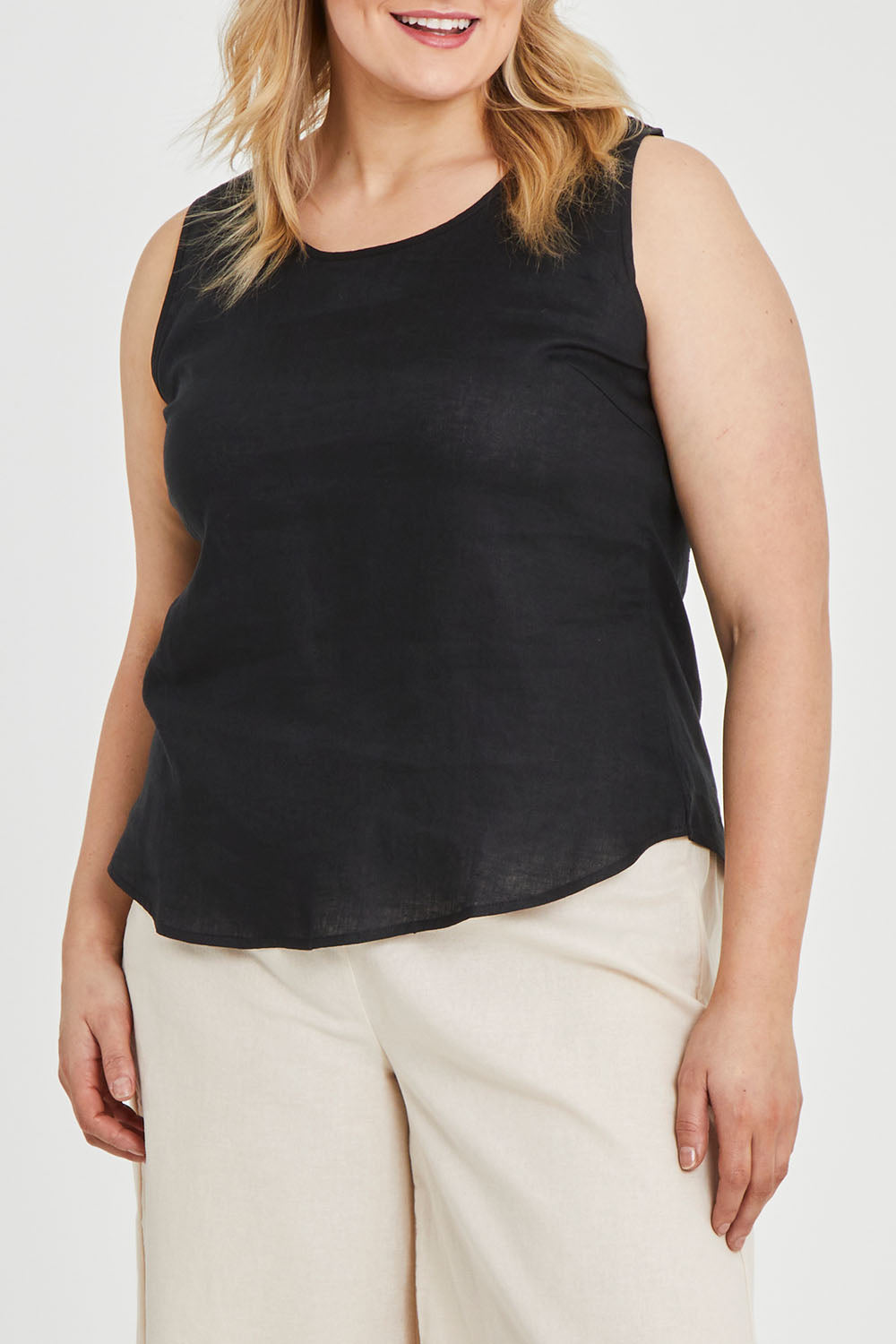 Model Keeara wearing size 16 of the Linen Tank in colour Black (Black), from the front, cropped image