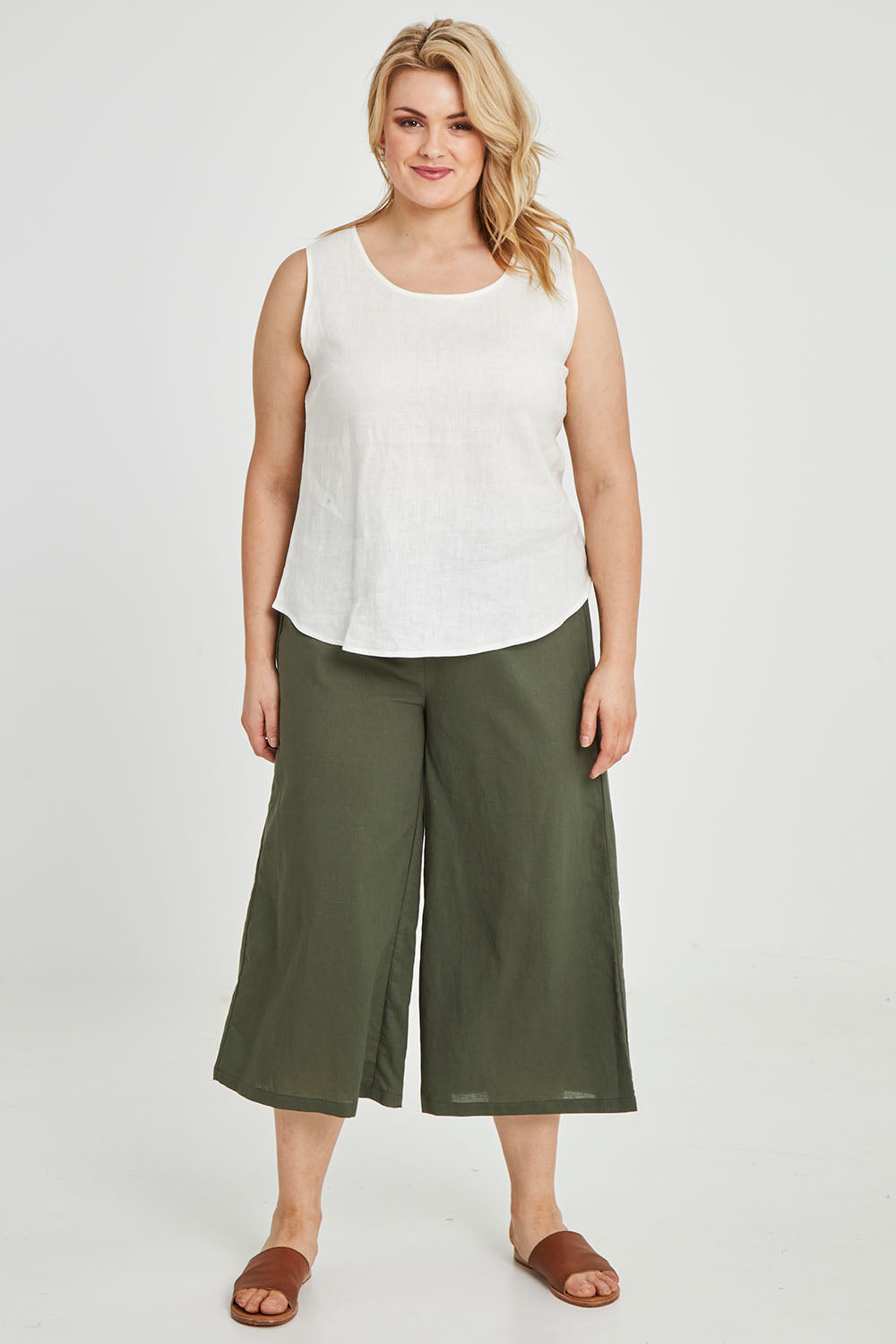 Model Keeara wearing size 16 of the Linen Tank in colour White (White), from the front, showing the whole outfit