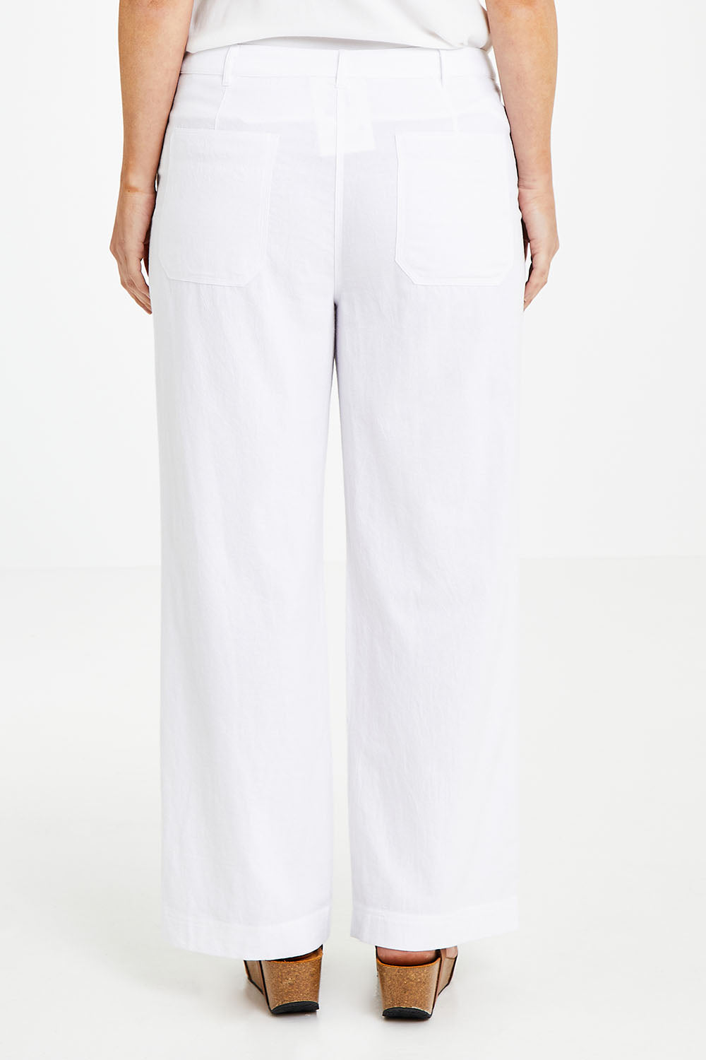 Model Laura wearing size 14 of the Cotton Wide Leg Pant in colour White (White), from the back