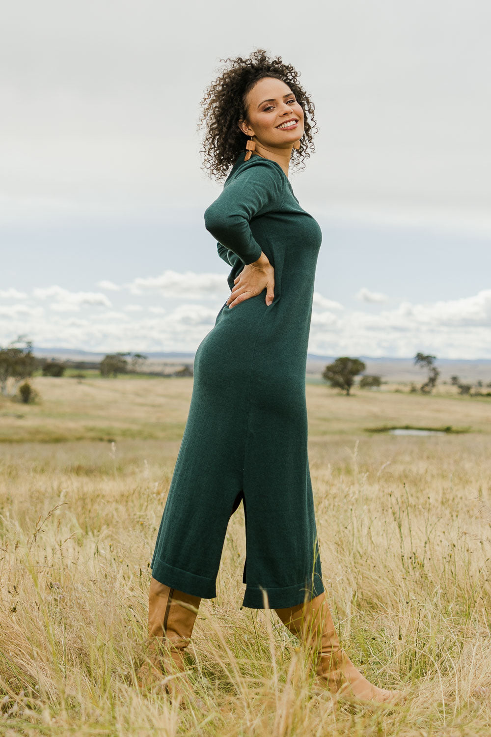 Model Lala wearing size S of the Cotton Cashmere Wool V Neck Knit Dress in colour Green (Green), from the front, showing the whole outfit