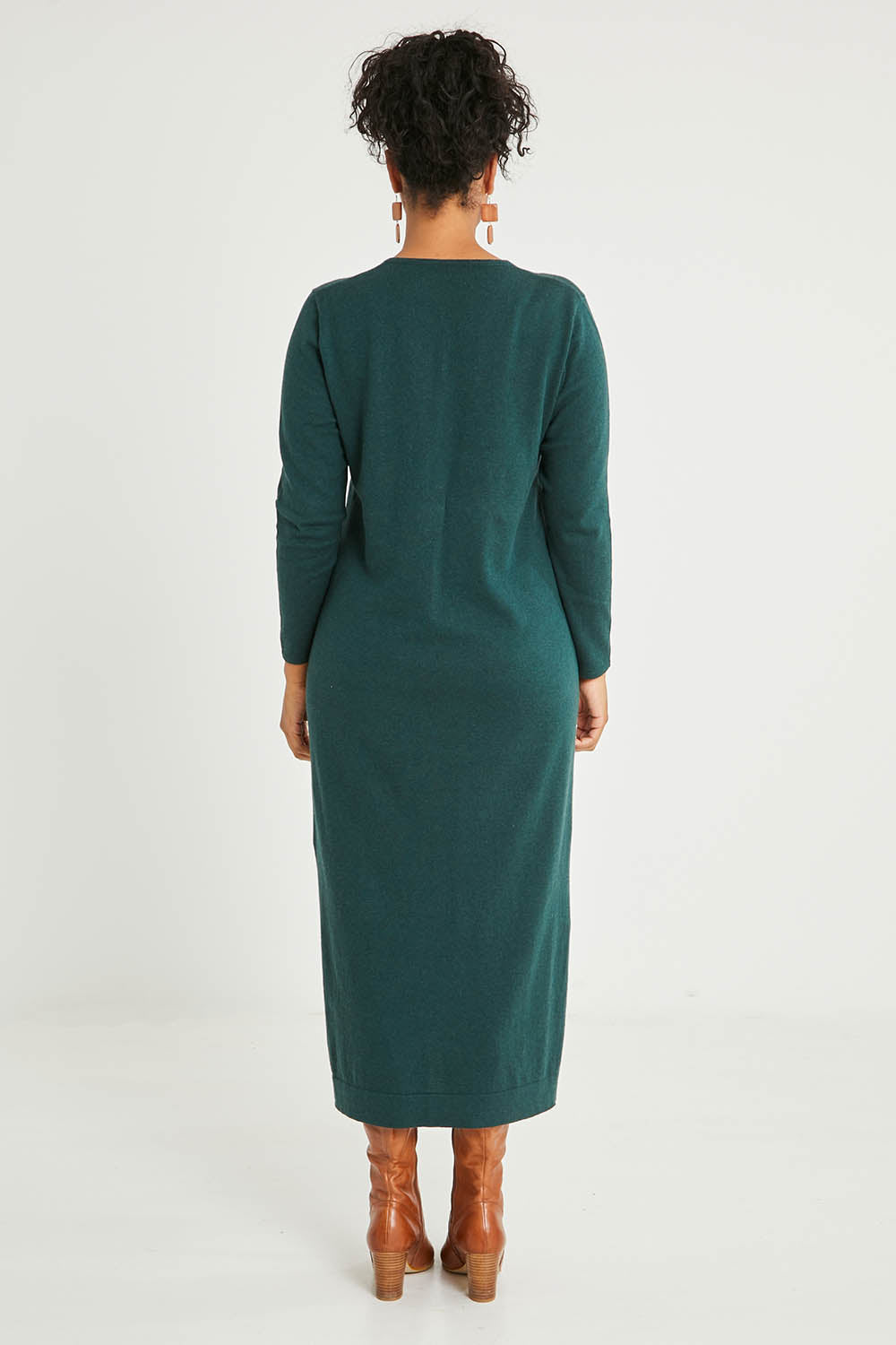 Model Noli wearing size L of the Cotton Cashmere Wool V Neck Knit Dress in colour Green (Green), from the back