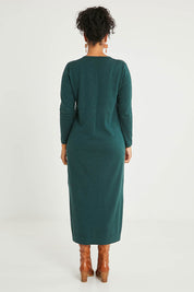 Model Noli wearing size L of the Cotton Cashmere Wool V Neck Knit Dress in colour Green (Green), from the back