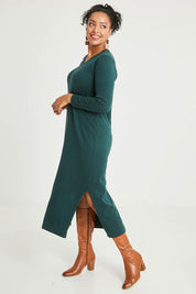 Model Noli wearing size L of the Cotton Cashmere Wool V Neck Knit Dress in colour Green (Green), from the front, showing the whole outfit