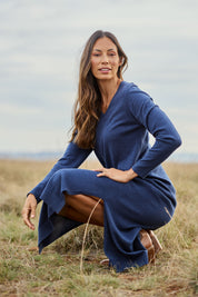 Model Amanda wearing size S of the Cotton Cashmere Wool V Neck Knit Dress in colour Marlin (Blue), from the front, showing the whole outfit
