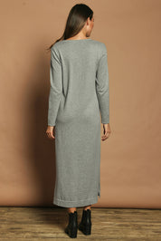 Model Madeline wearing size S of the Cotton Cashmere Wool V Neck Knit Dress in colour Opalgrey (Grey), from the back