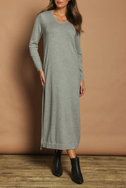 Model Madeline wearing size S of the Cotton Cashmere Wool V Neck Knit Dress in colour Opalgrey (Grey), from the front, cropped image