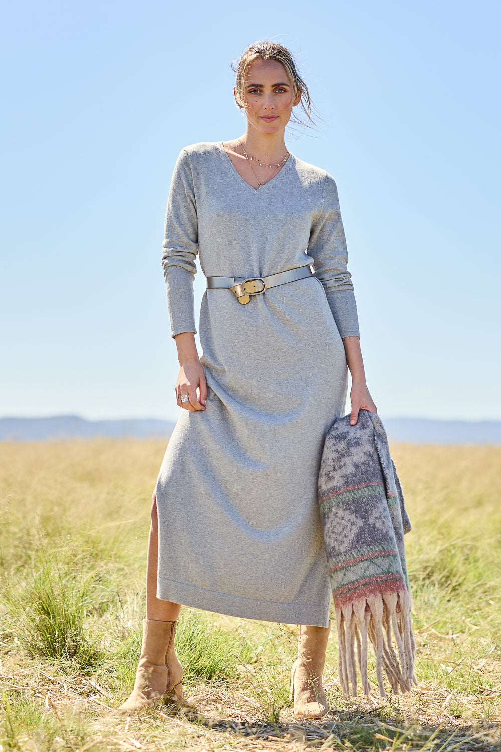 Model Tegan wearing size S of the Cotton Cashmere Wool V Neck Knit Dress in colour Opalgrey (Grey), from the front, showing the whole outfit
