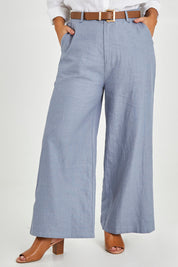 Model Monique wearing size 14 of the Linen Cotton Wide Leg Pant in colour Chambray (Blue), from the front, cropped image