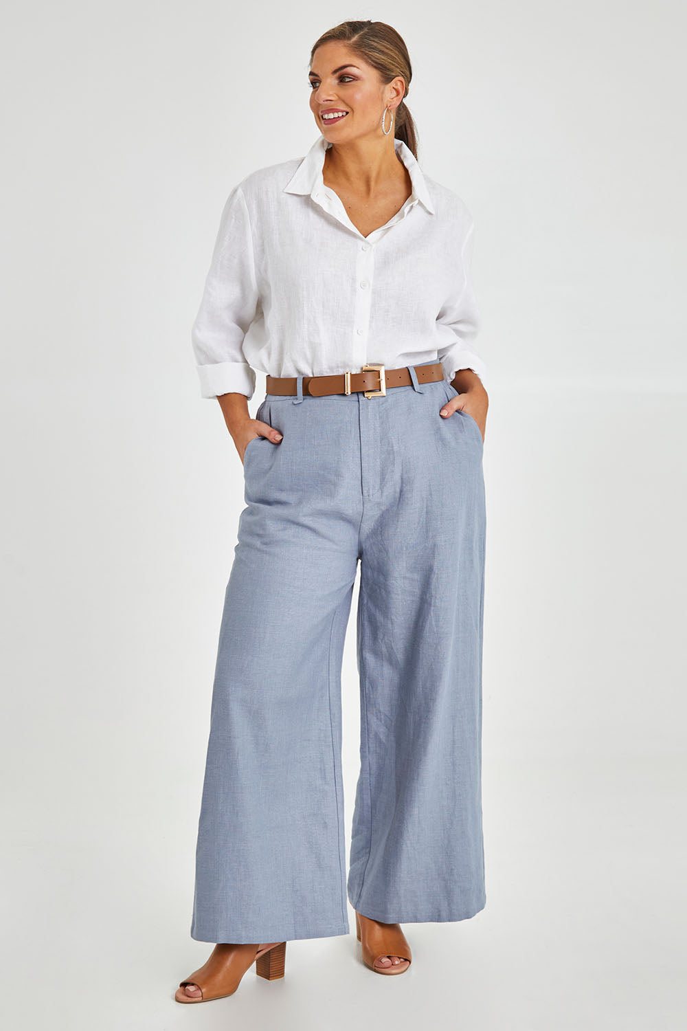 Model Monique wearing size 14 of the Linen Cotton Wide Leg Pant in colour Chambray (Blue), from the front, showing the whole outfit