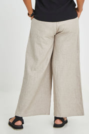 Model Noli wearing size 14 of the Linen Cotton Wide Leg Pant in colour Desertsand, from the back